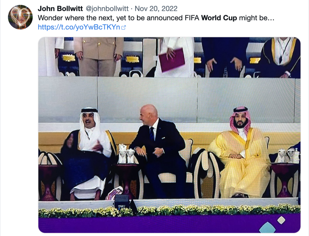 A screenshot of my archived Twitter account where I posted the text, "Wonder where the next, yet to be announced FIFA World Cup might be..." over the top of a photo I took of my TV during the opening ceremonies of the FIFA World Cup 2022 where the head of FIFA is seated between the leader of Qatar to his right and the leader of Saudi Arabia to his left. 